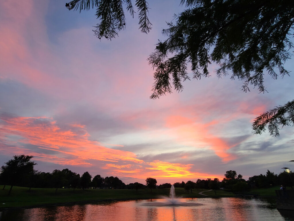 Lake reflecting clouds in sunset